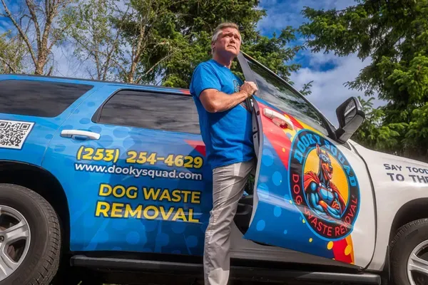 The operator behind Lupa standing by his branded service truck
